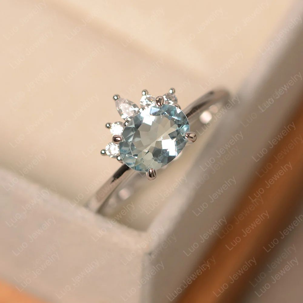 Half Sunburst Oval Aquamarine Ring