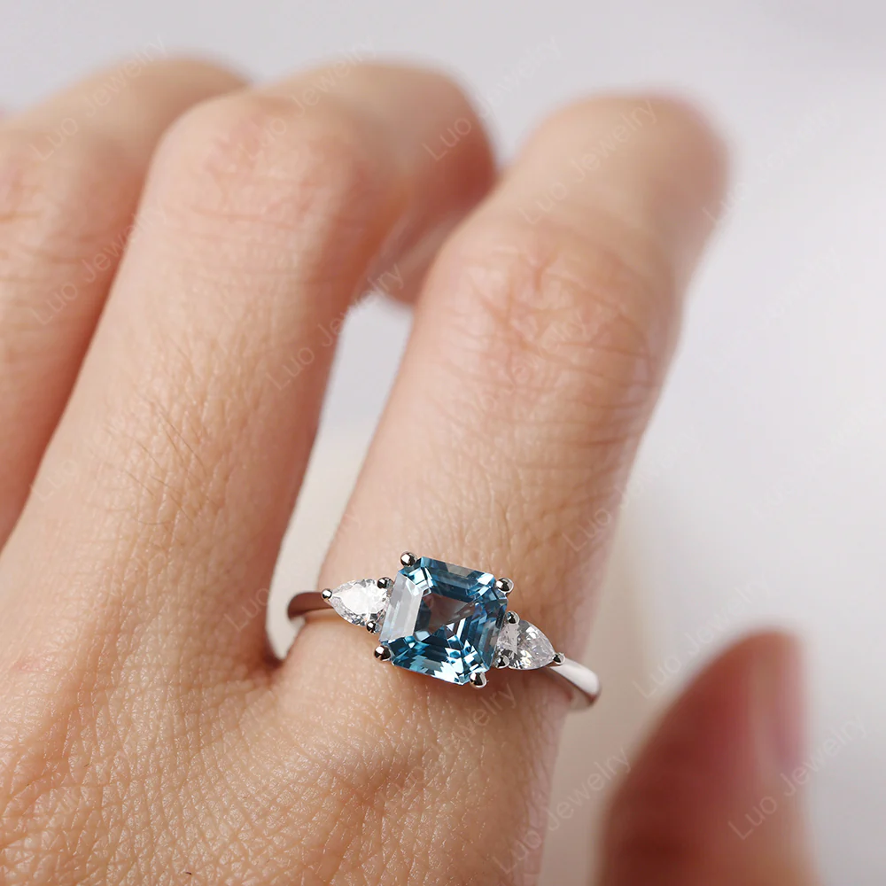 Asscher Swiss Blue Topaz Ring with Pear Side Stone - Image 5
