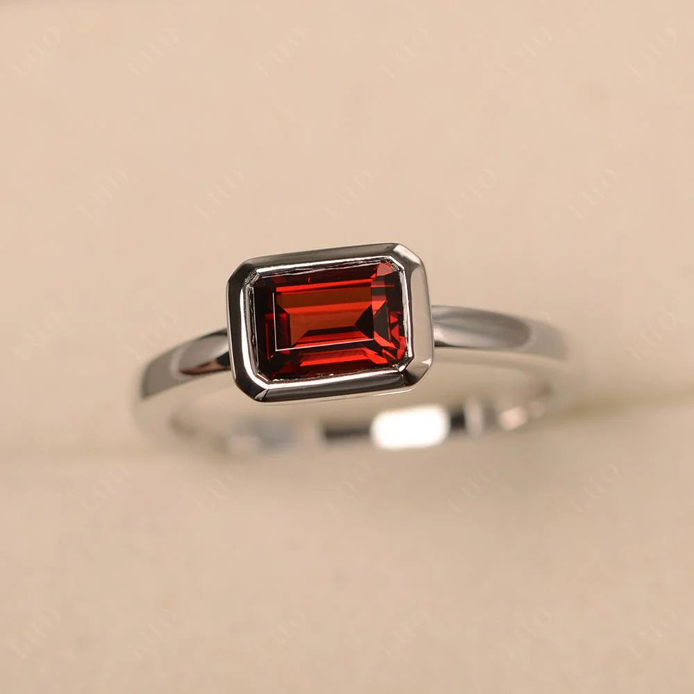 East West Emerald Cut Garnet Bezel Ring - Image 29
