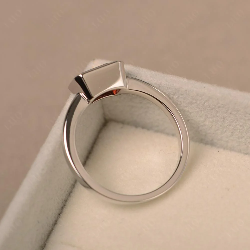 East West Emerald Cut Garnet Bezel Ring - Image 31