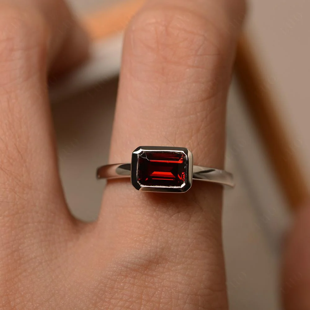 East West Emerald Cut Garnet Bezel Ring - Image 32