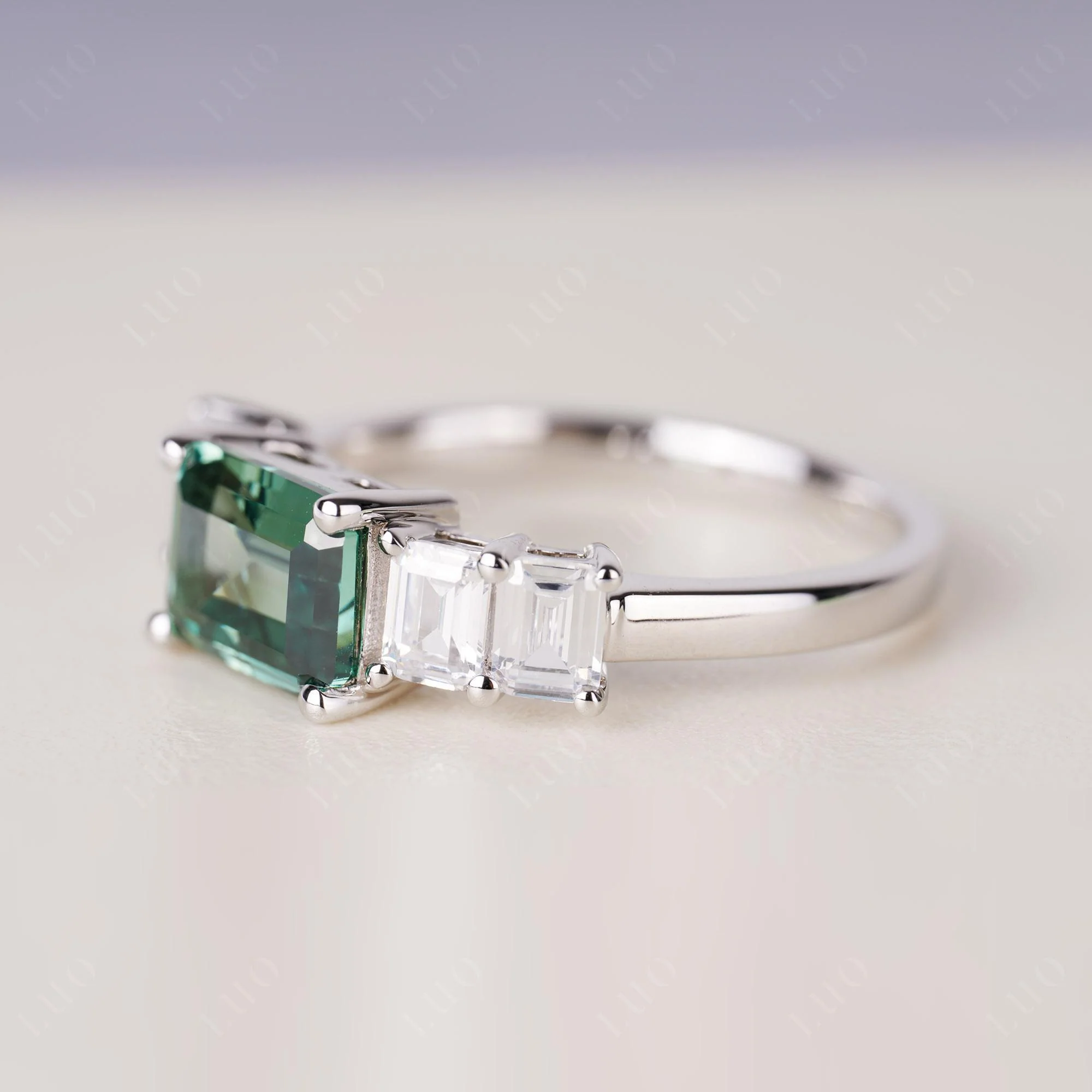East West Emerald Cut Green Sapphire Ring - Image 2