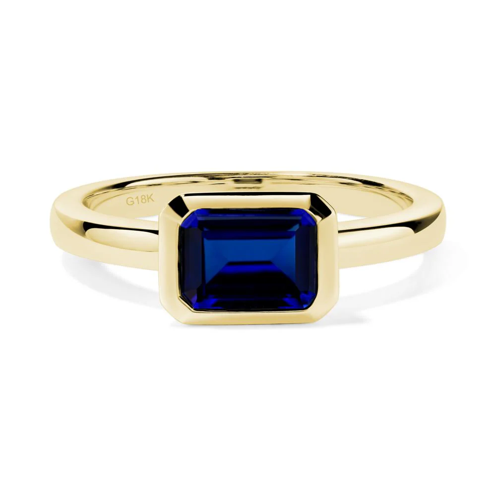 East West Emerald Cut Sapphire Bezel Ring - Image 2