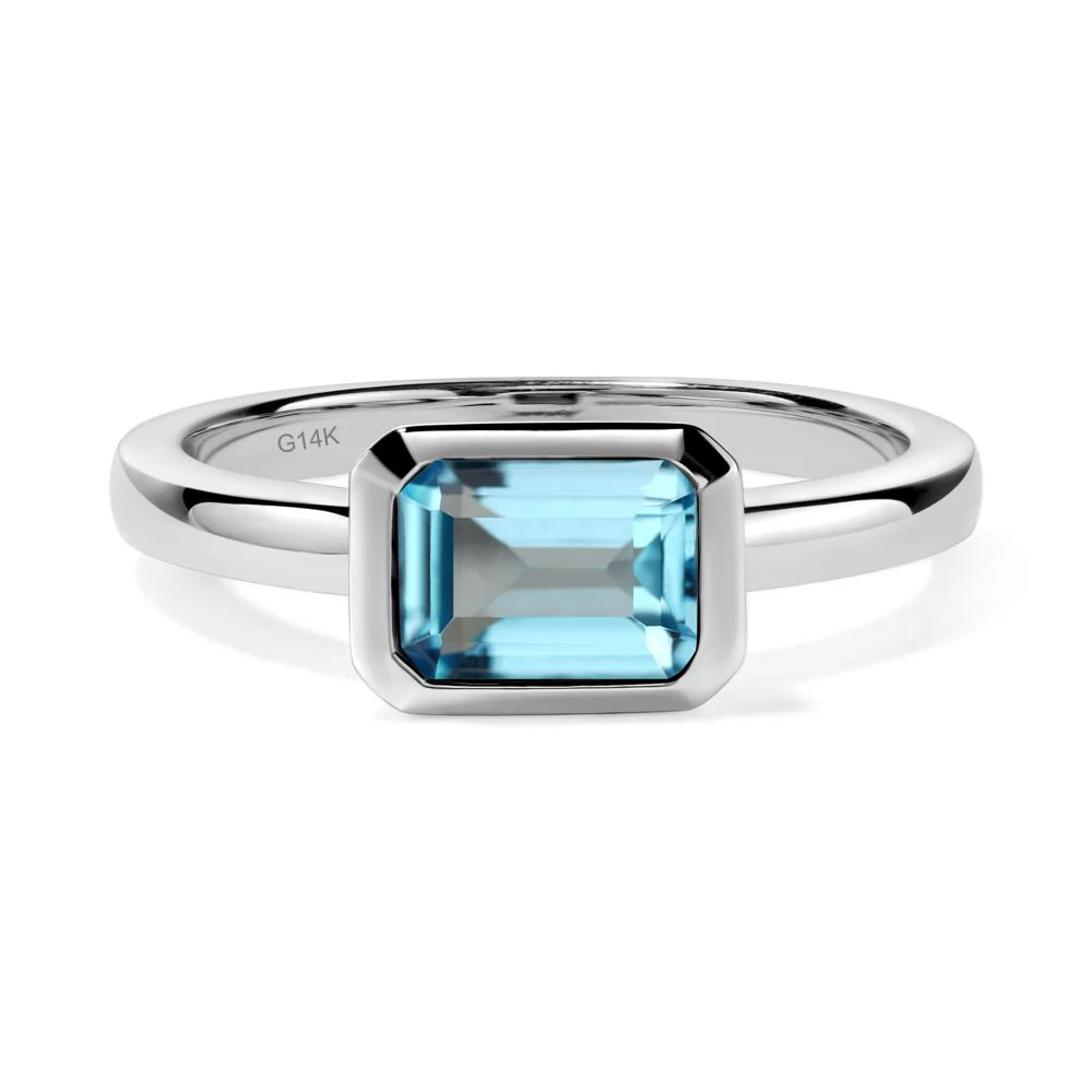 East West Emerald Cut Swiss Blue Topaz Bezel Ring