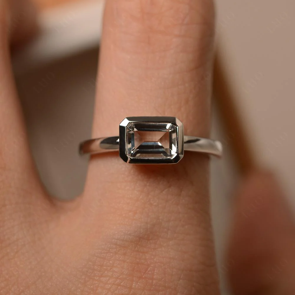 White Topaz Bezel Emerald Cut Engagement Ring - Image 32
