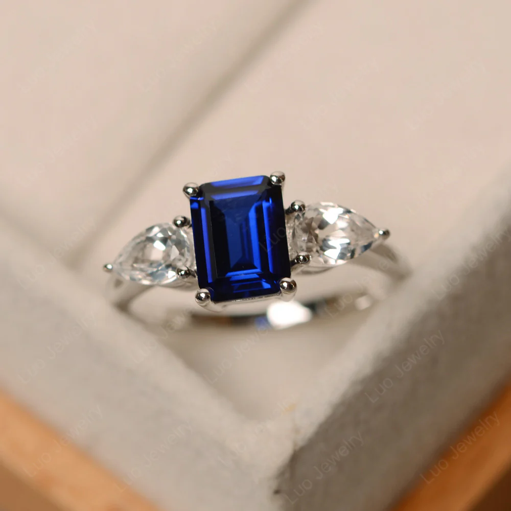 Sapphire Ring with Pear Side Stone