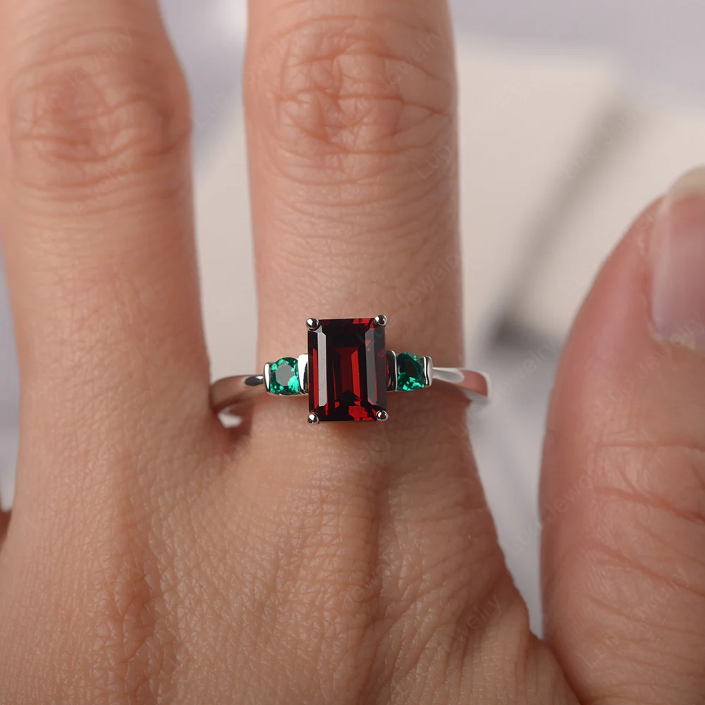 Emerald Cut Garnet and Emerald Trilogy Ring - Image 5