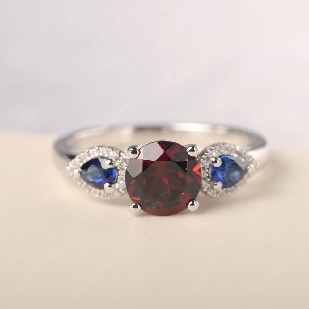 Euro Shank Garnet and Sapphire Ring
