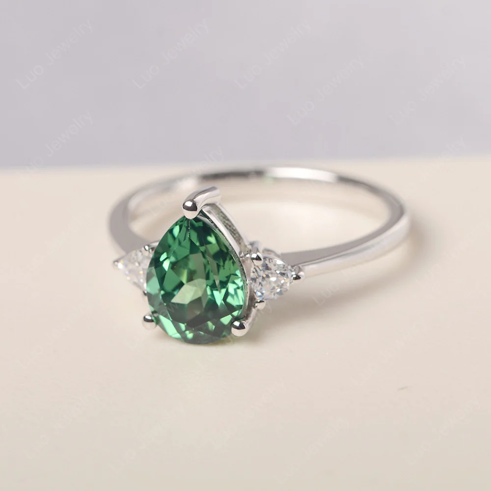 Teardrop Green Sapphire Trilogy Ring - Image 2