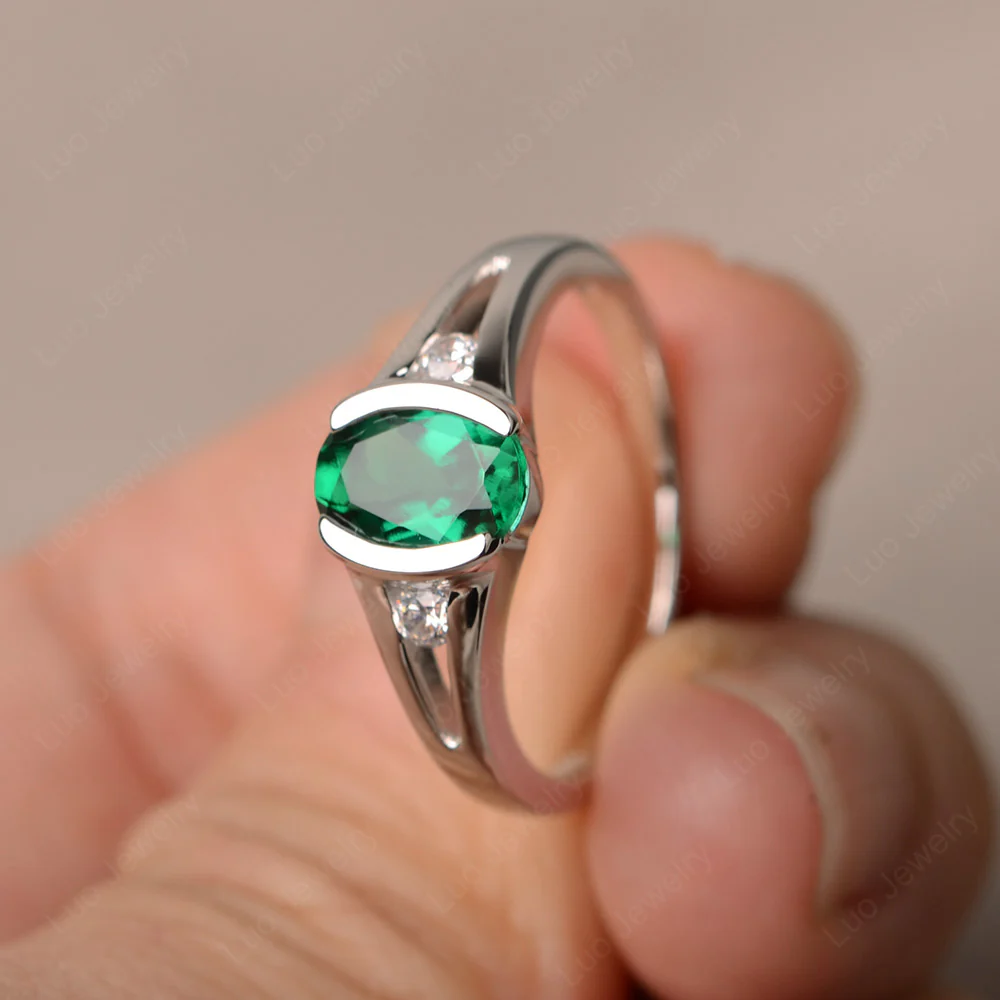 Half Bezel Set Oval Emerald Ring