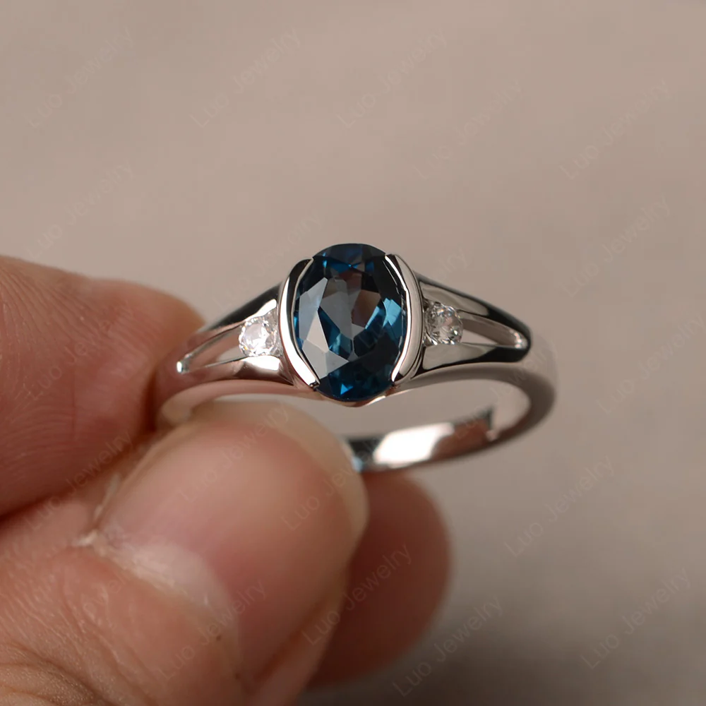 Half Bezel Set Oval London Blue Topaz Ring