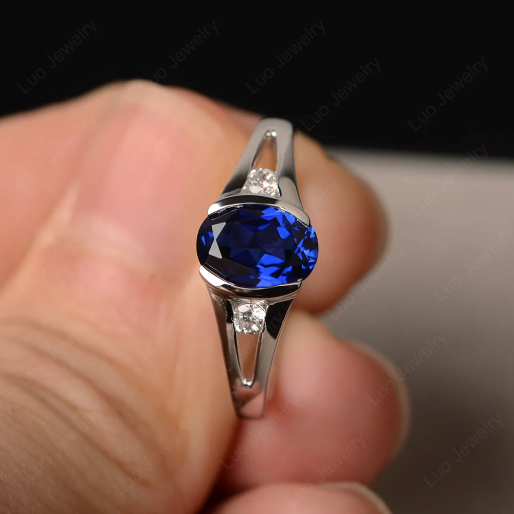 Half Bezel Set Oval Sapphire Ring - Image 2