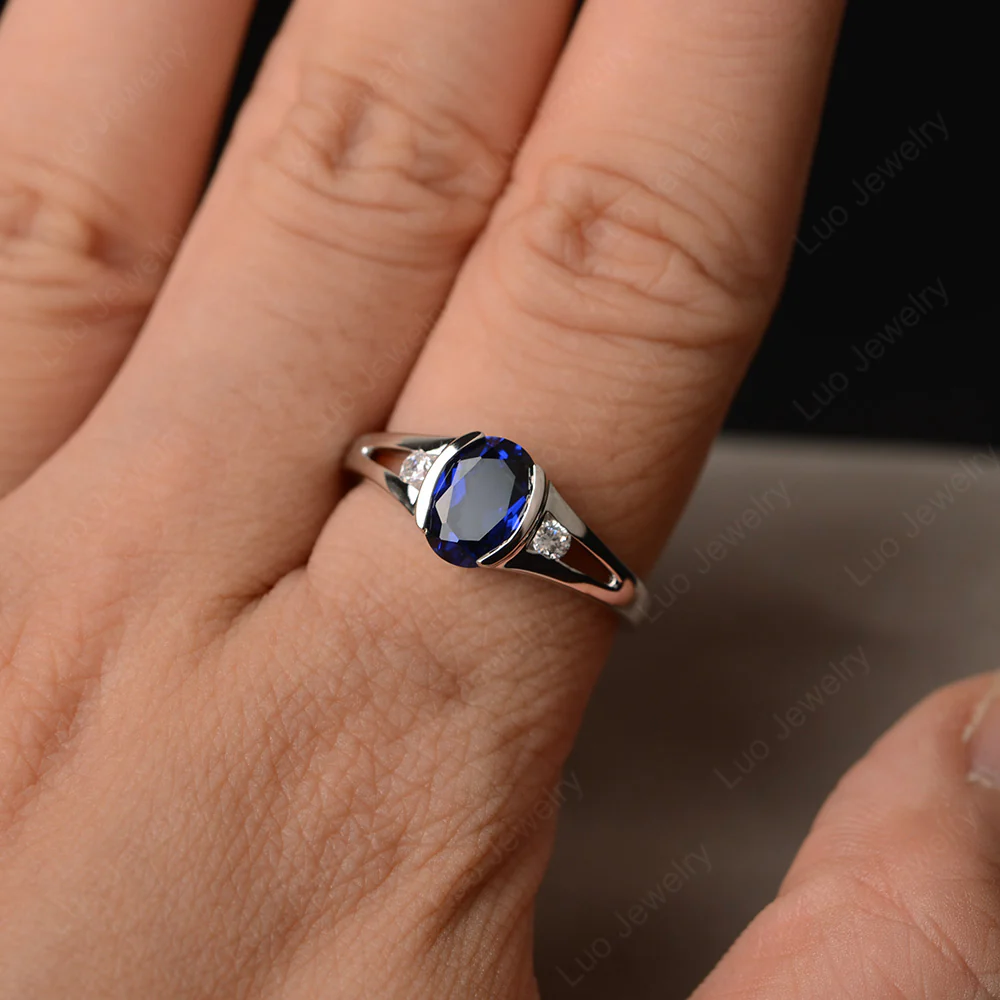 Half Bezel Set Oval Sapphire Ring - Image 4