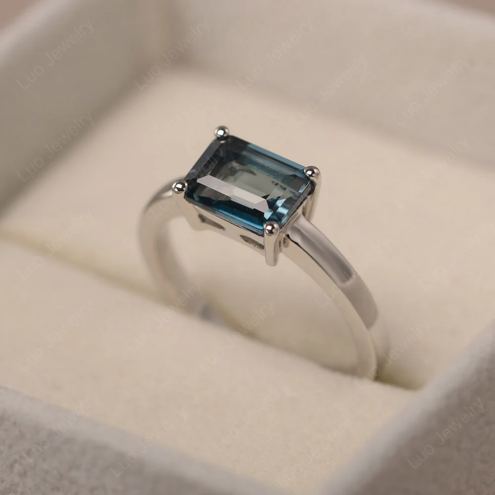 Horizontal Emerald Cut London Blue Topaz Solitaire Ring