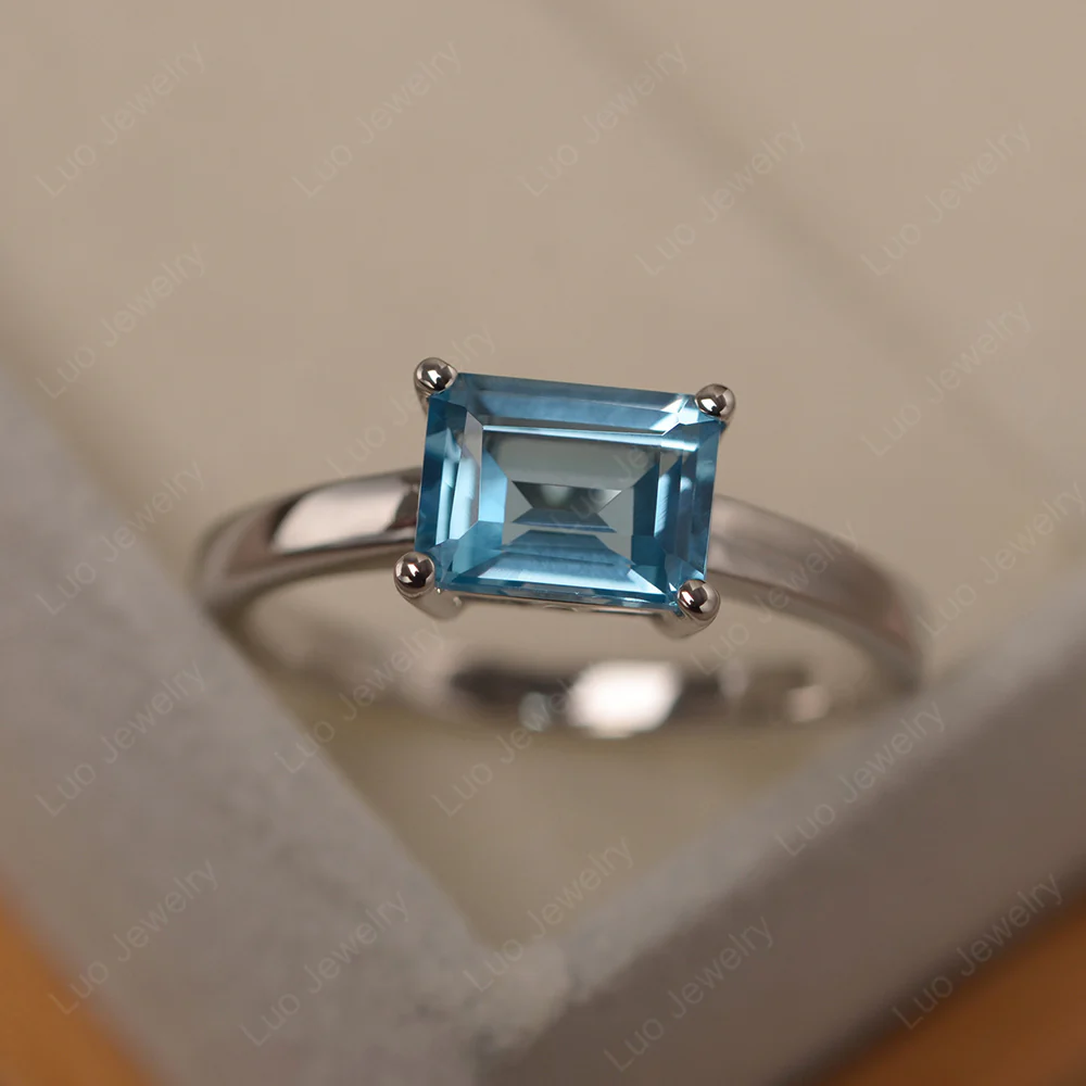 Horizontal Emerald Cut Swiss Blue Topaz Solitaire Ring