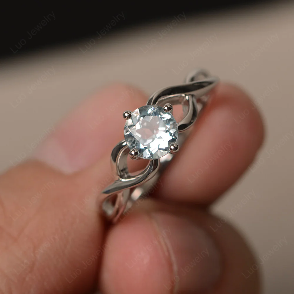 Round Aquamarine Twist Solitaire Ring