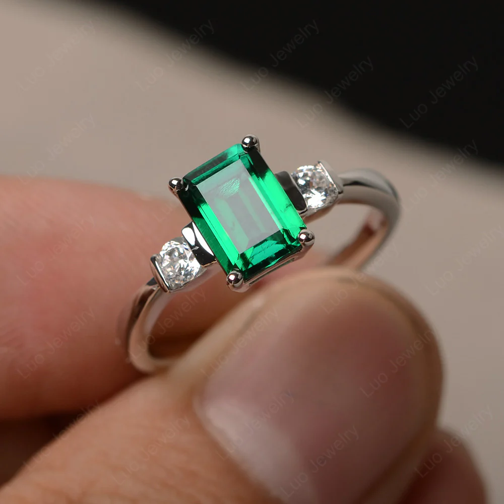 Emerald Cut Emerald Trilogy Ring - Image 2