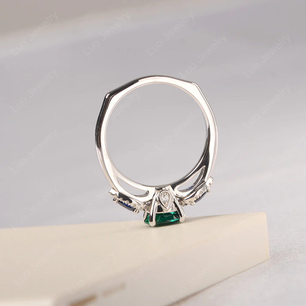 Euro Shank Emerald and Sapphire Ring - Image 4