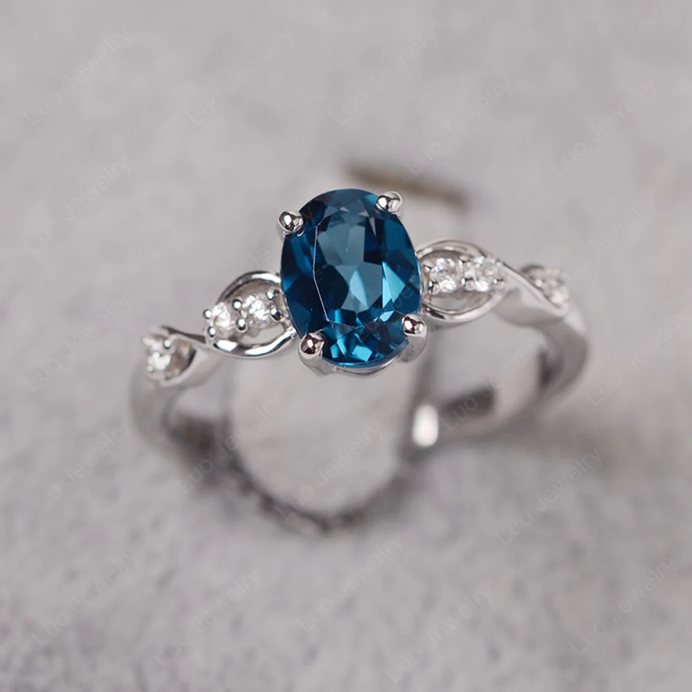 Oval London Blue Topaz Infinity Engagement Ring
