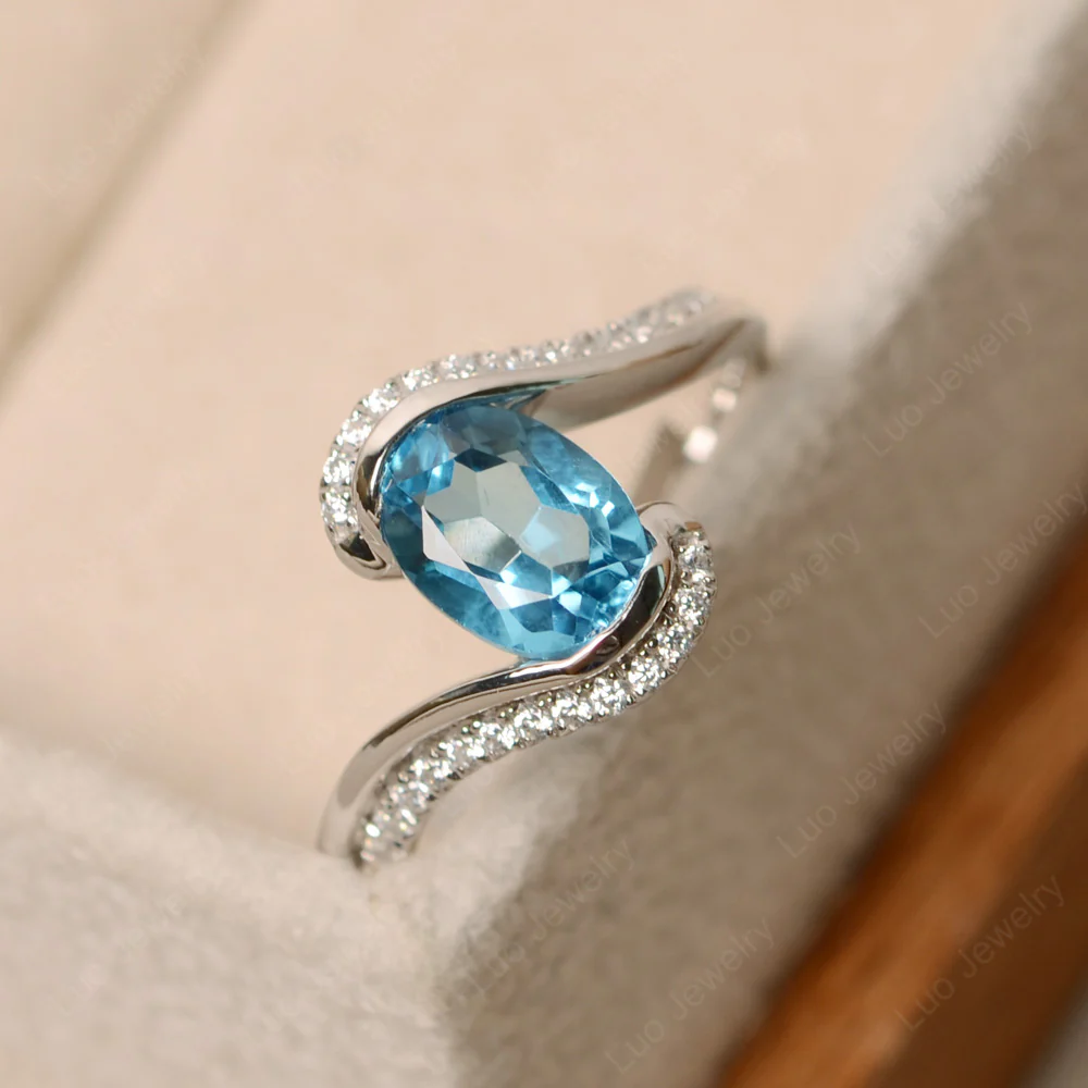 Oval Bezel Swiss Blue Topaz Engagement Ring