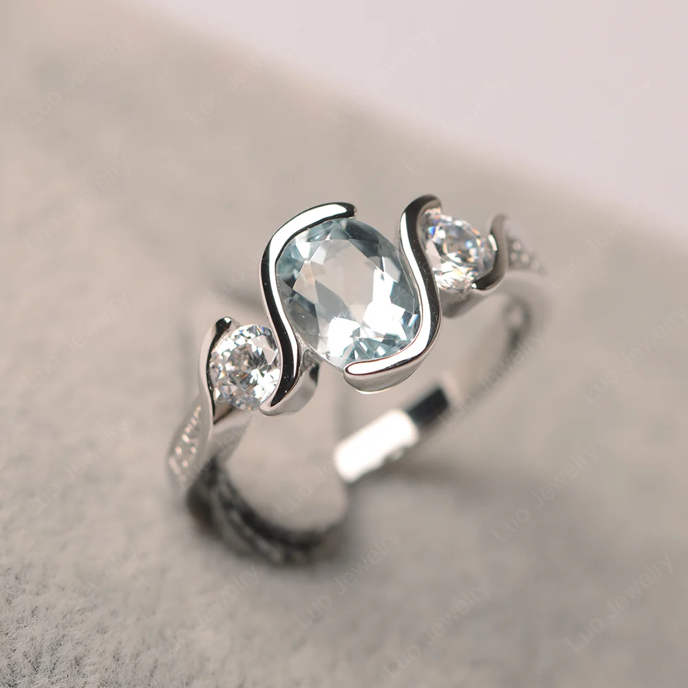 Oval Cut Aquamarine Swirl Ring