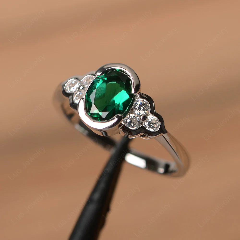 Oval Cut Bezel Set Emerald Engagement Ring