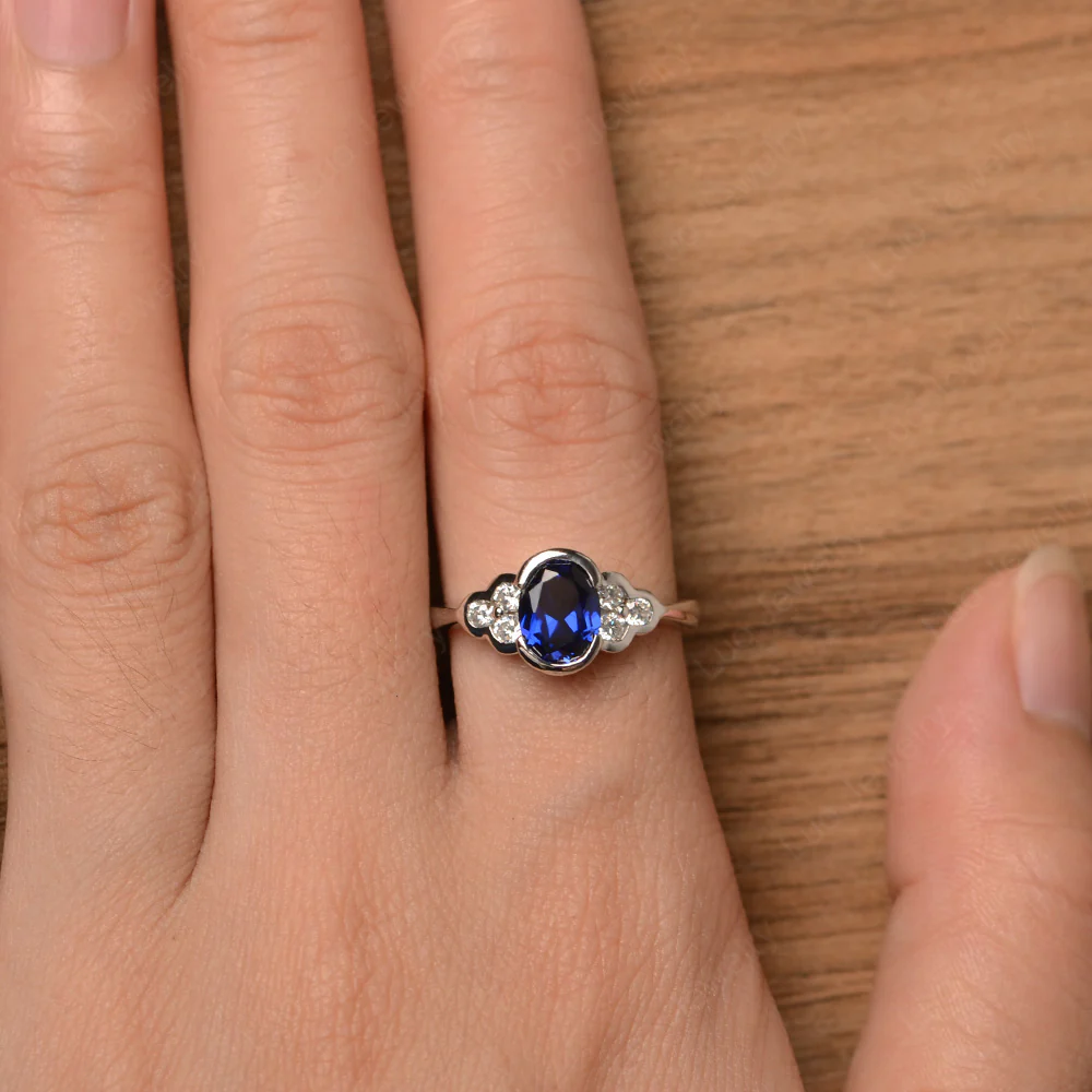 Oval Cut Bezel Set Sapphire Engagement Ring - Image 4