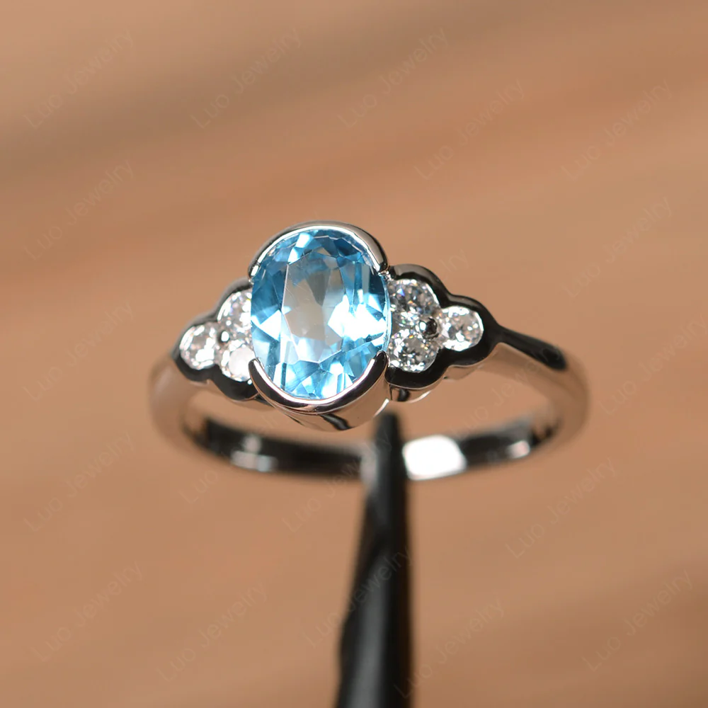 Oval Cut Bezel Set Swiss Blue Topaz Engagement Ring