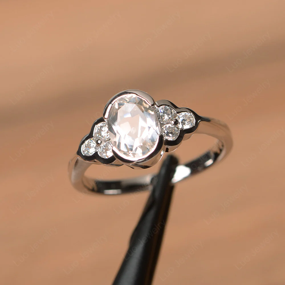 Oval Cut Bezel Set White Topaz Engagement Ring