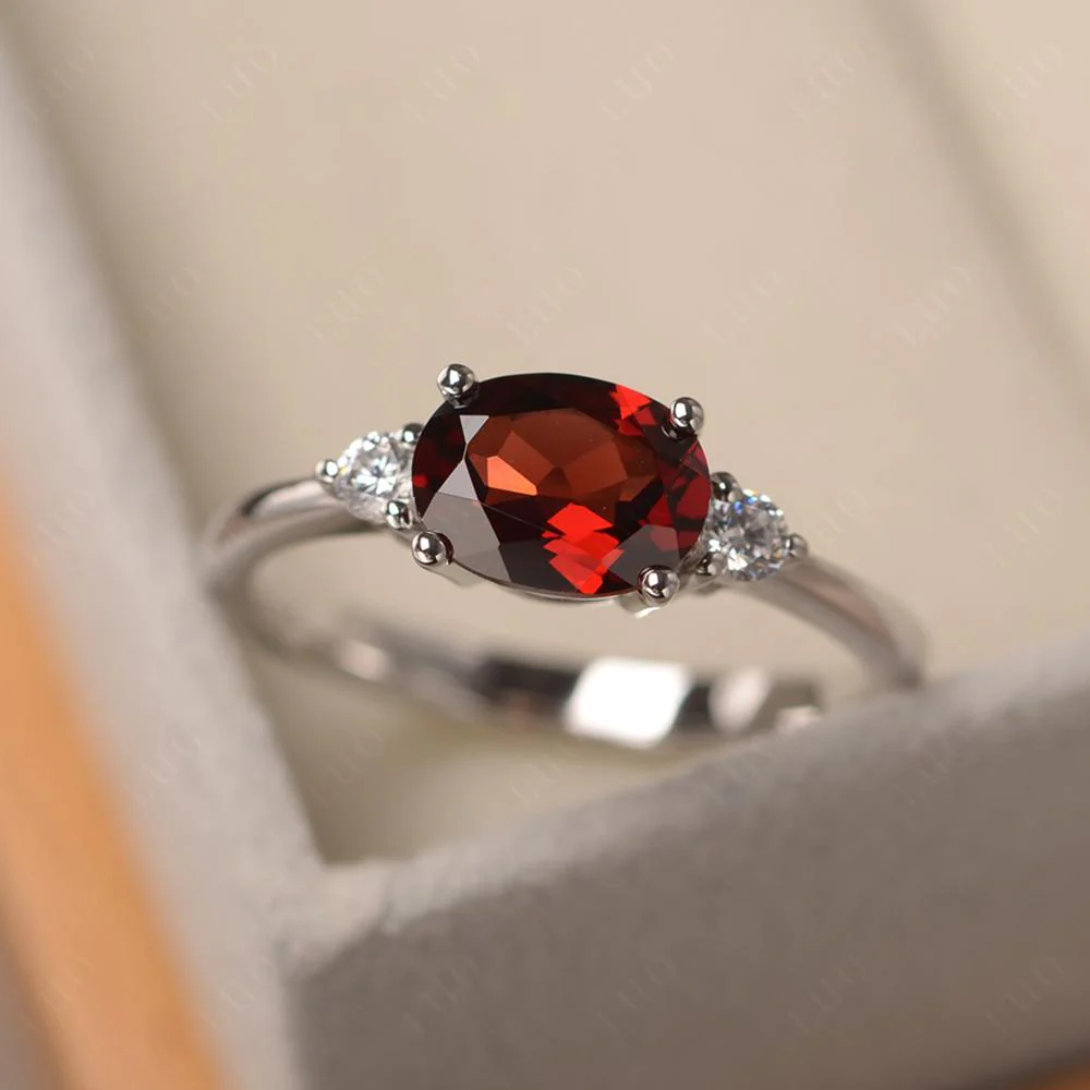Oval East West Garnet Trilogy Ring - Image 10