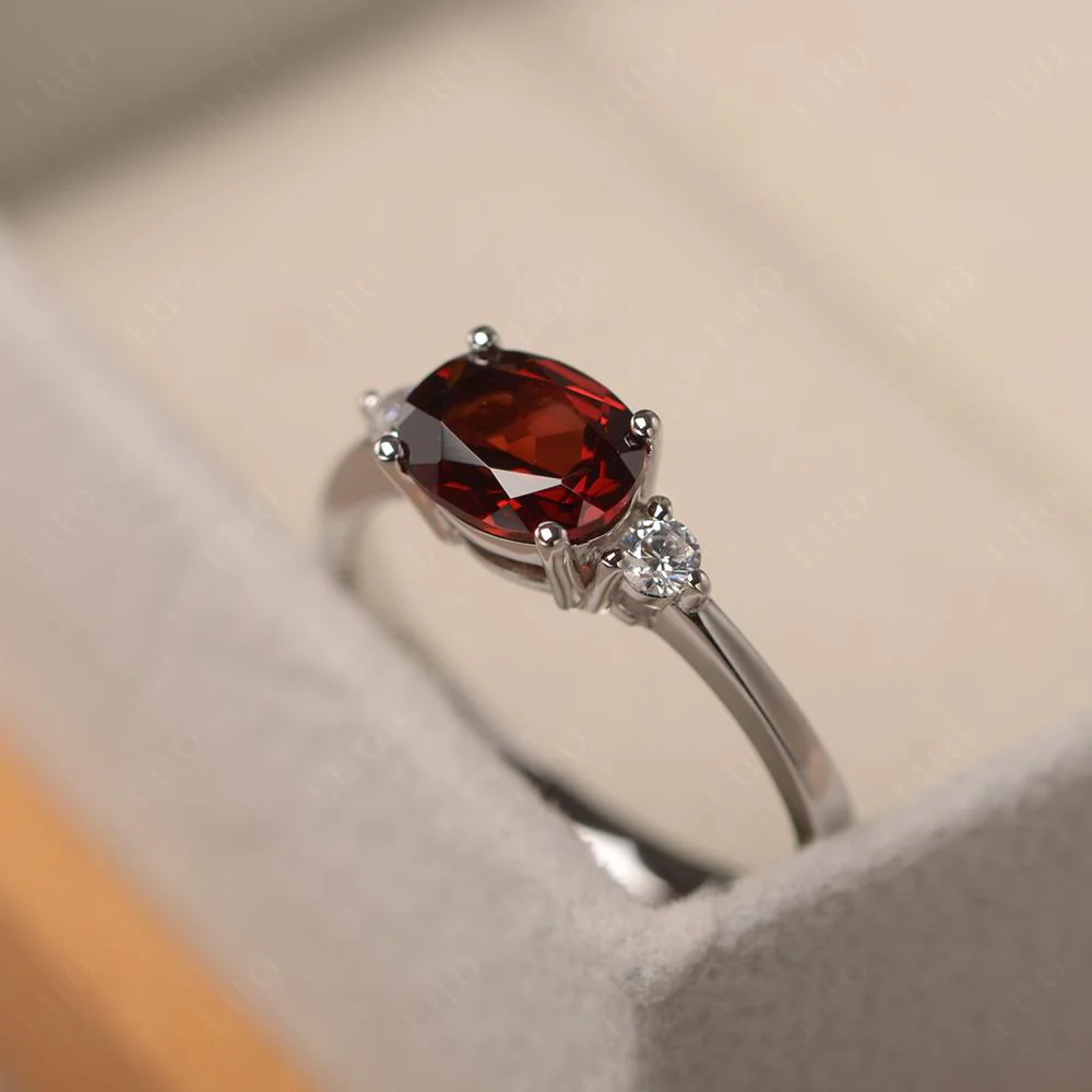 Oval East West Garnet Trilogy Ring - Image 11