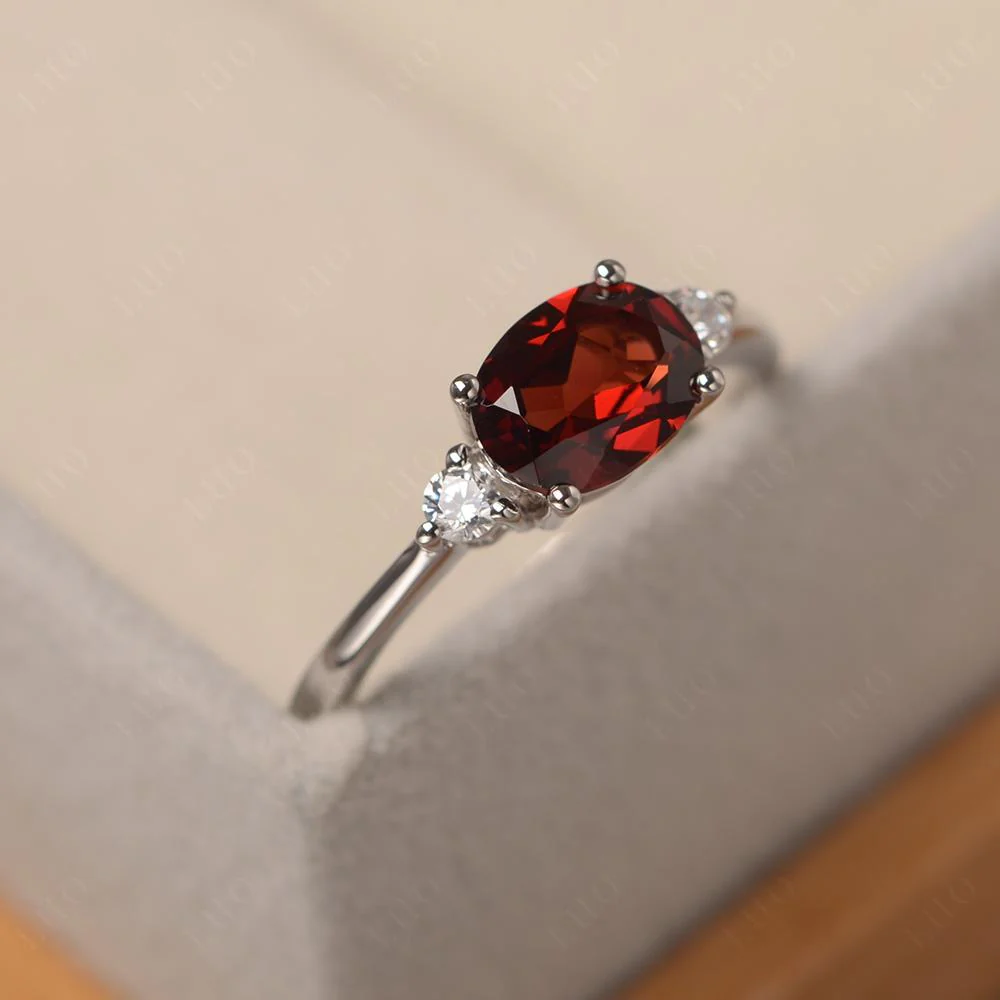 Oval East West Garnet Trilogy Ring - Image 12