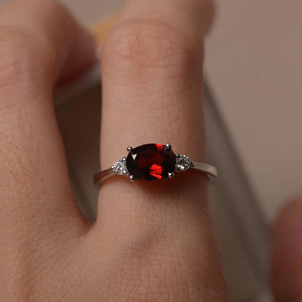 Oval East West Garnet Trilogy Ring - Image 15