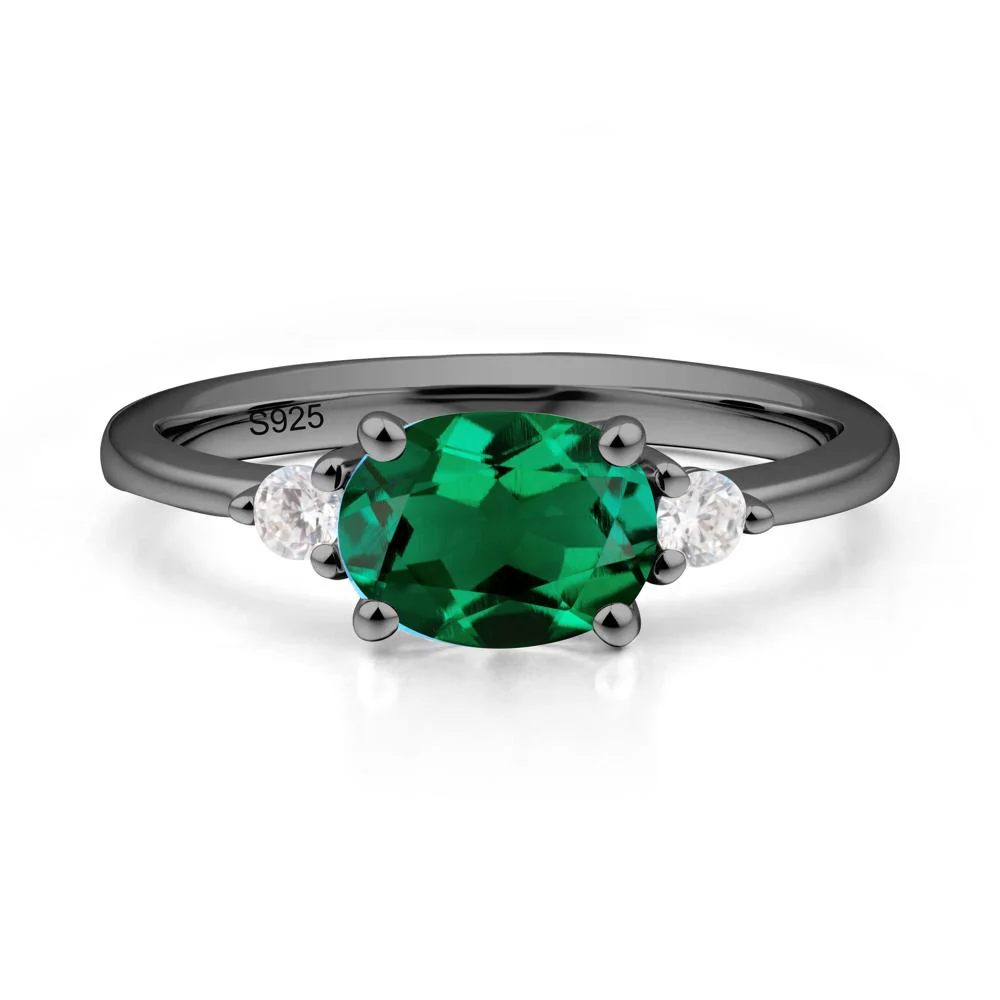 Oval East West Emerald Trilogy Ring