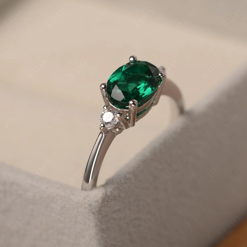 Oval East West Emerald Trilogy Ring - Image 11