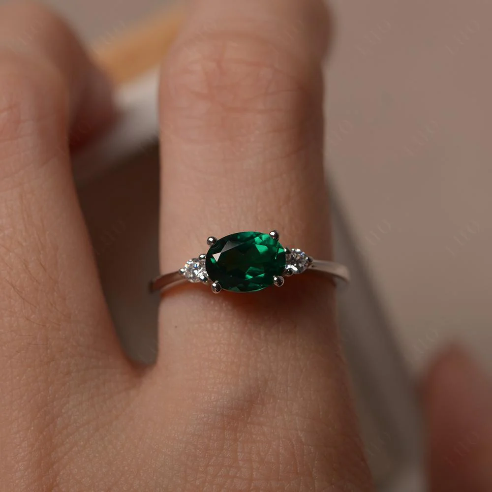 Oval East West Emerald Trilogy Ring - Image 15