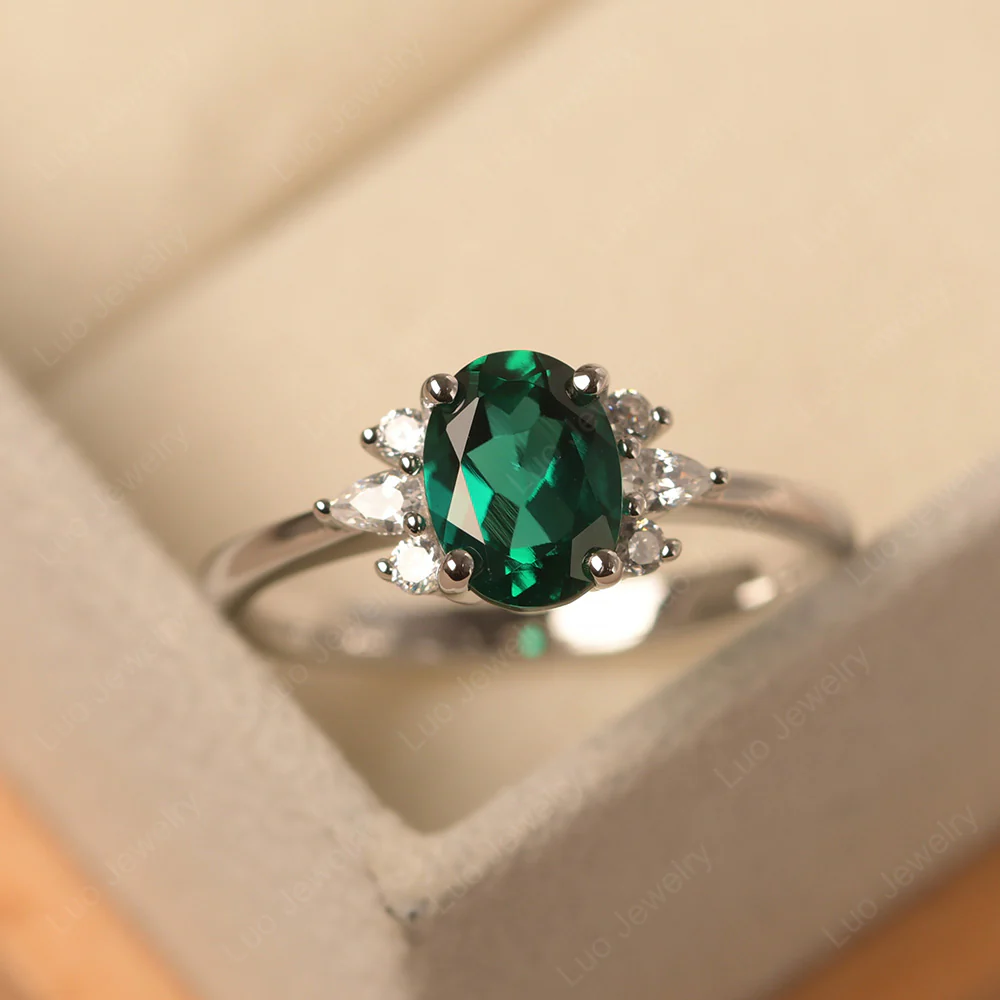 Oval Emerald Ring with Pear Side Stone