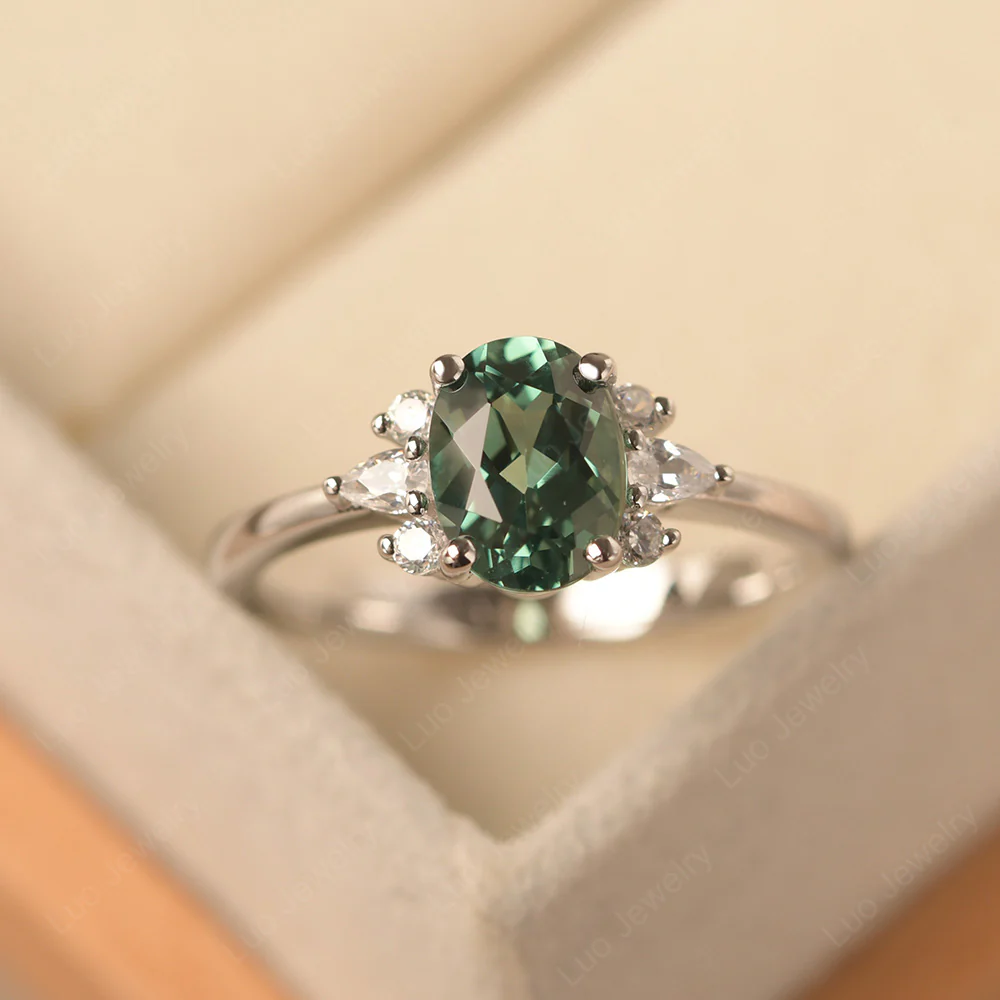 Oval Green Sapphire Ring with Pear Side Stone