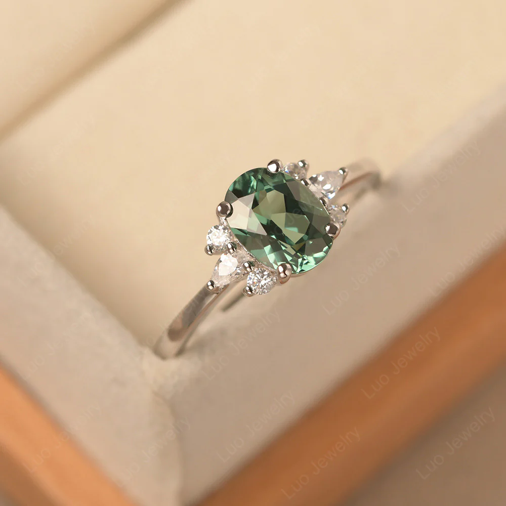 Oval Green Sapphire Ring with Pear Side Stone - Image 2