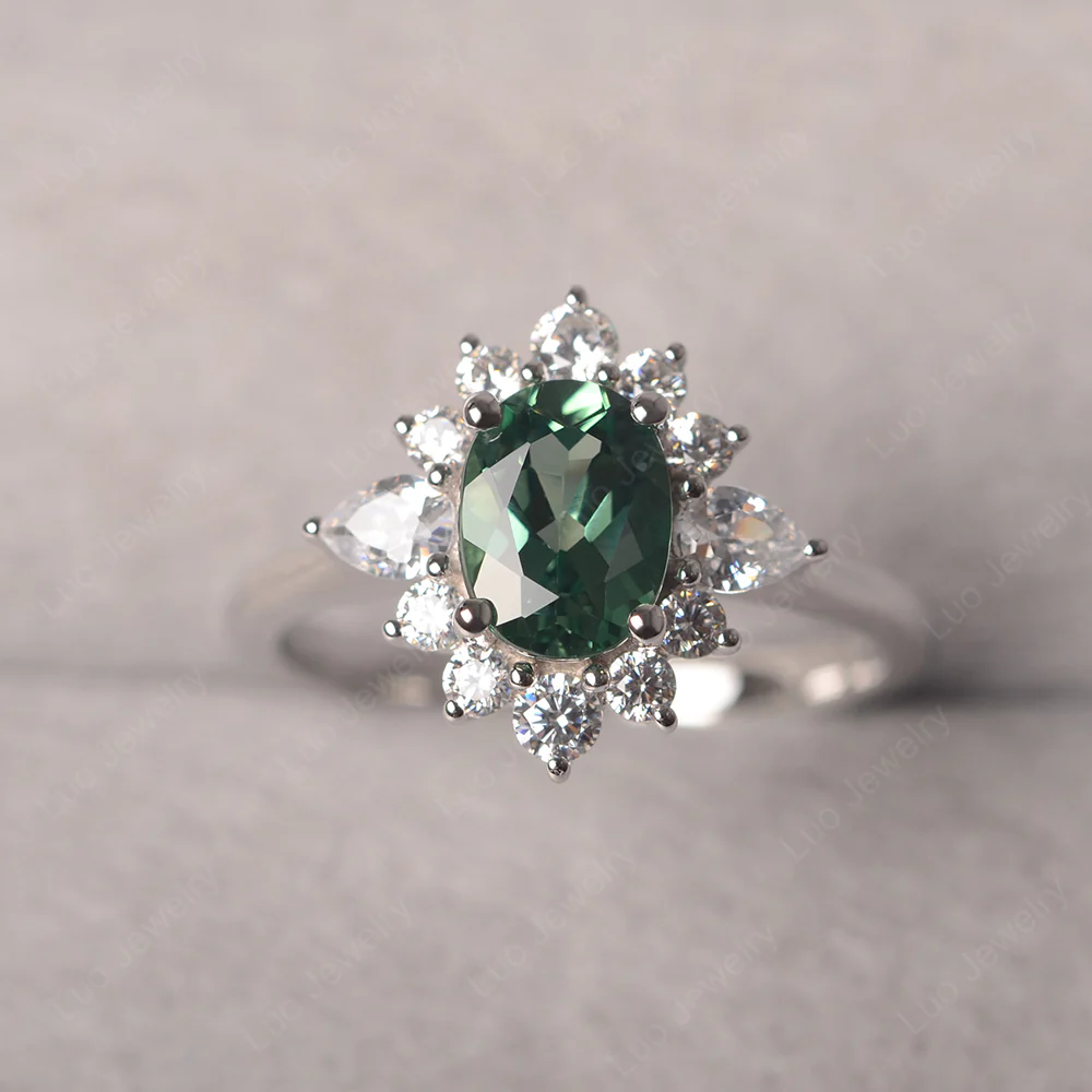 Oval Cut Green Sapphire Ring with Pear Side Stone