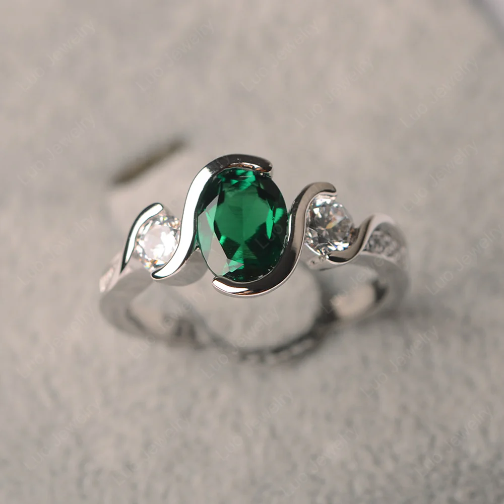 Oval Cut Emerald Swirl Ring