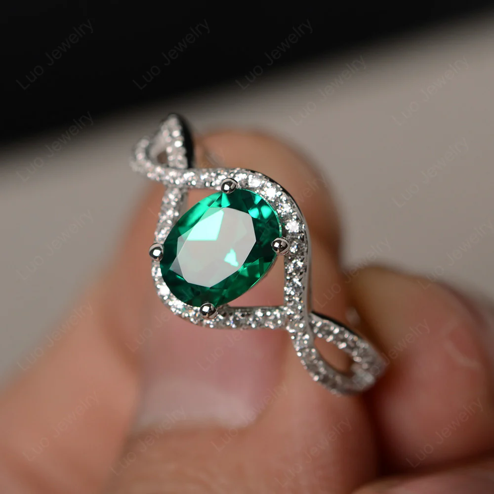 Oval Emerald Twisted Engagement Ring