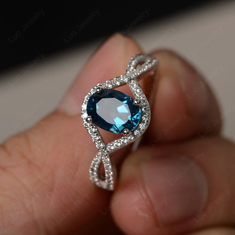 Oval London Blue Topaz Twisted Engagement Ring
