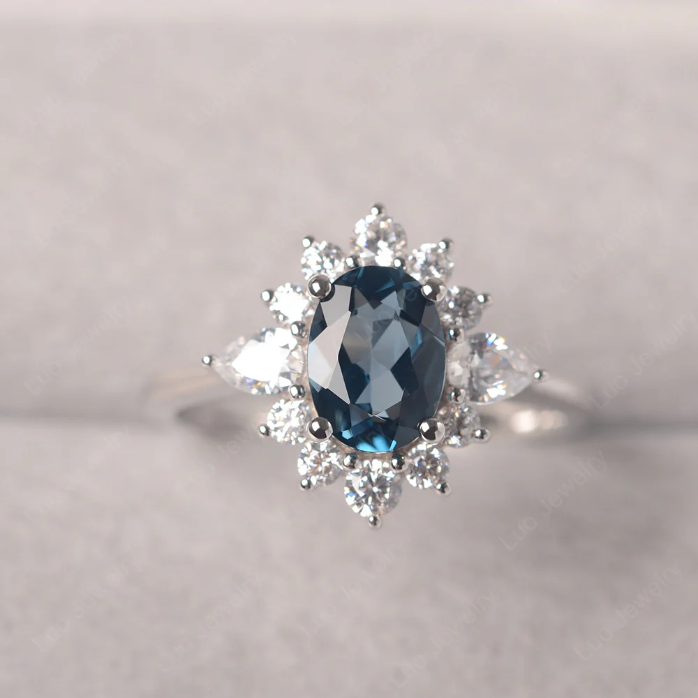 Oval Cut London Blue Topaz Ring with Pear Side Stone