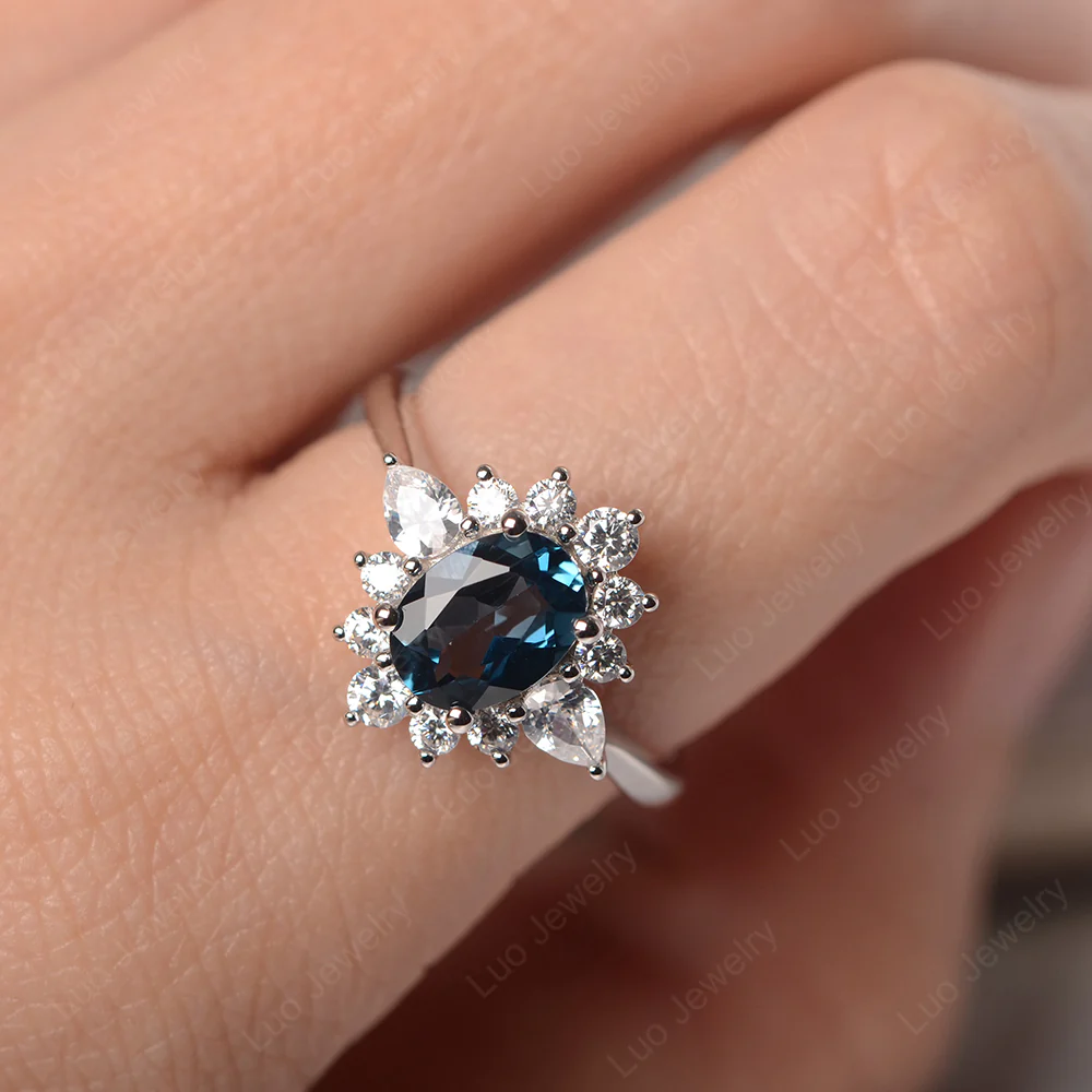 Oval Cut London Blue Topaz Ring with Pear Side Stone - Image 5