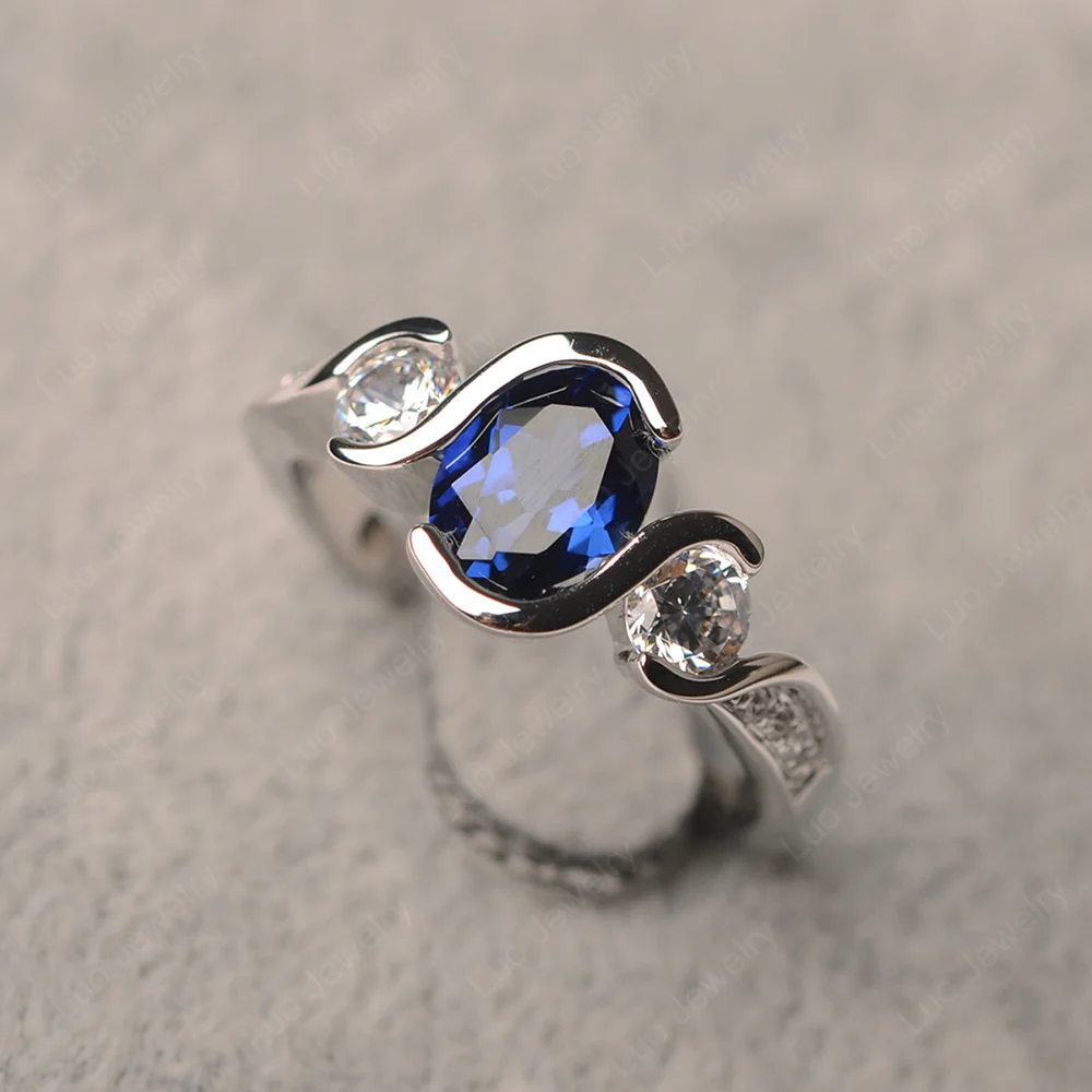 Oval Cut Sapphire Swirl Ring