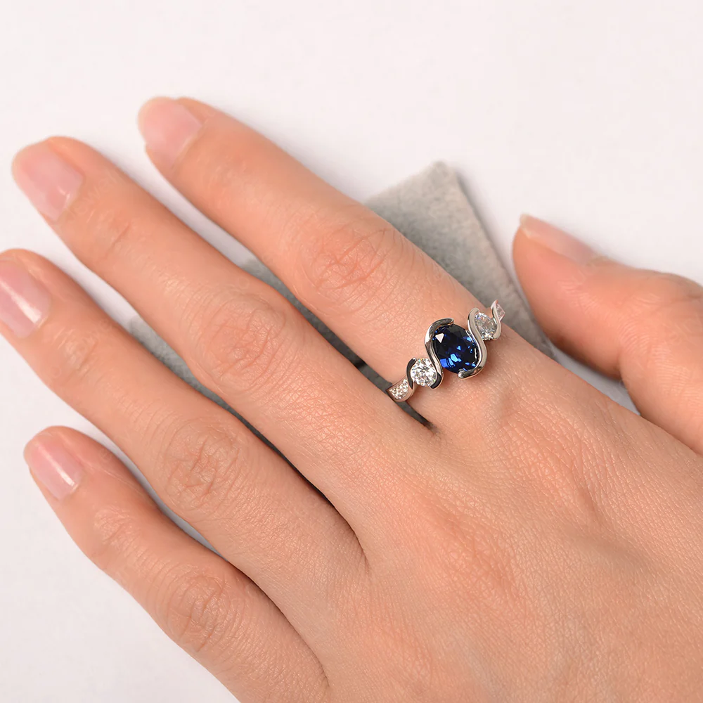 Oval Cut Sapphire Swirl Ring - Image 4