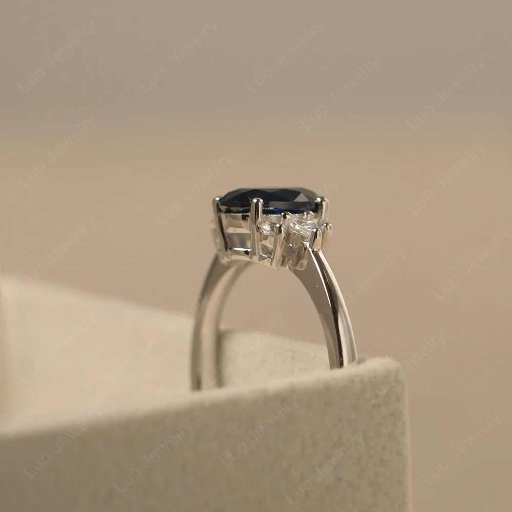 Oval Sapphire Ring with Pear Side Stone - Image 4