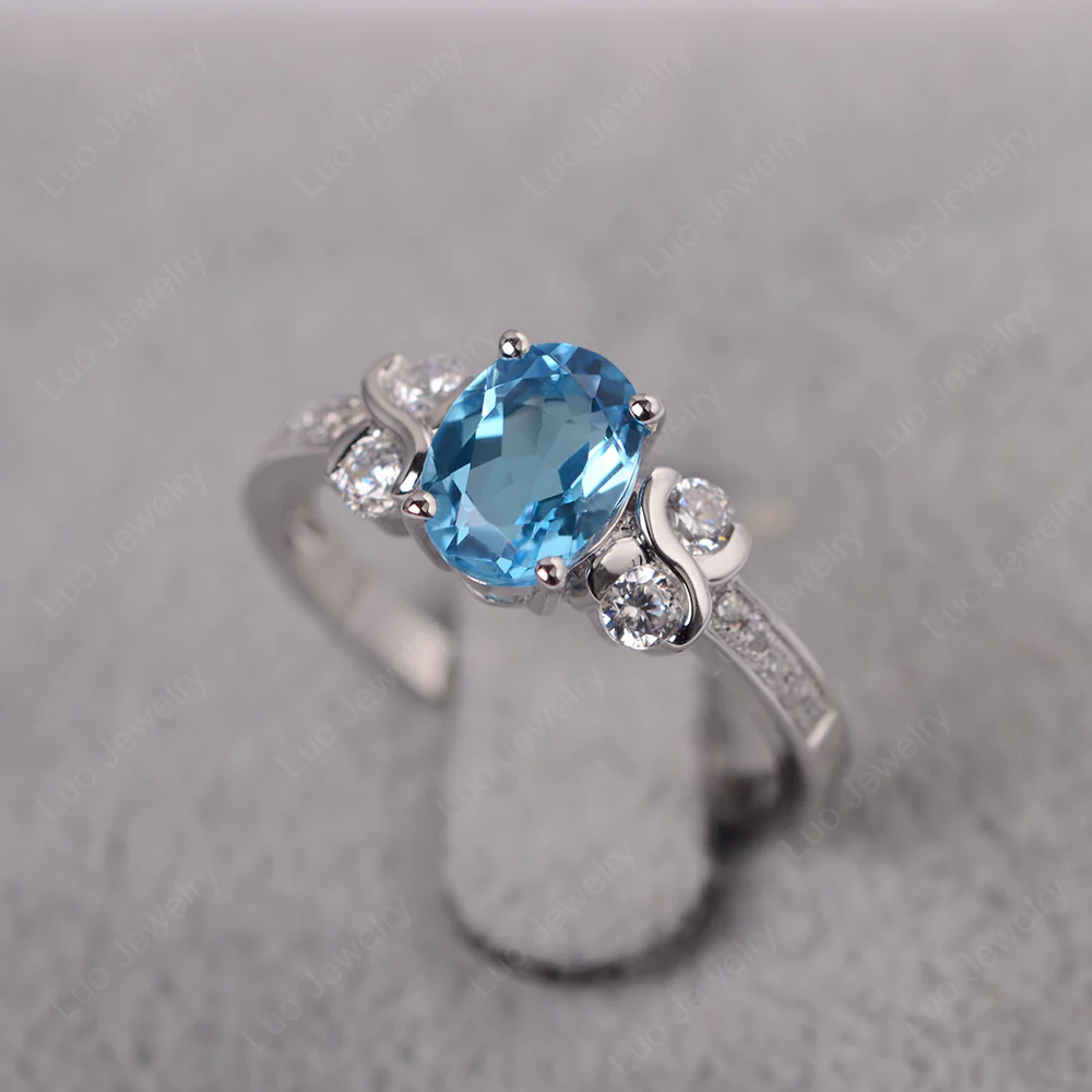 Swiss Blue Topaz Infinity Oval Engagement Ring - Image 2