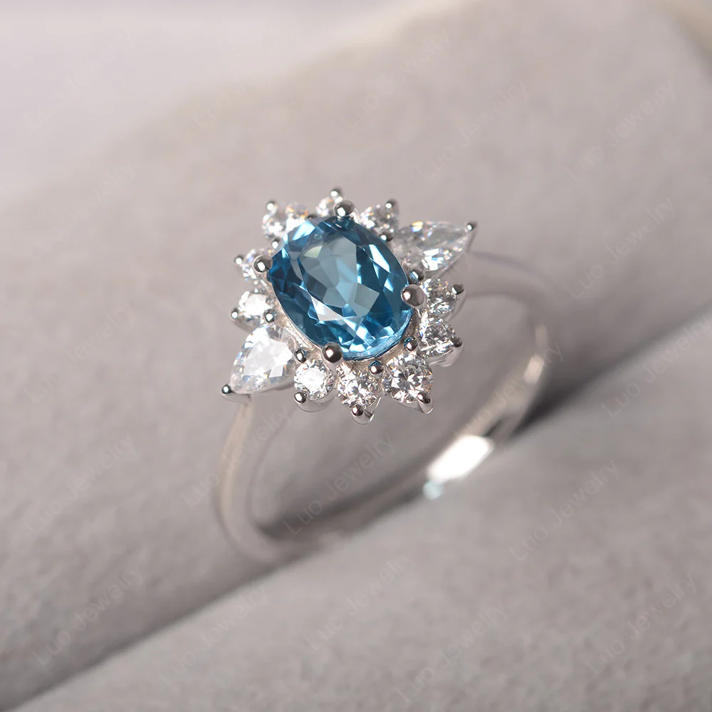Oval Cut Swiss Blue Topaz Ring with Pear Side Stone
